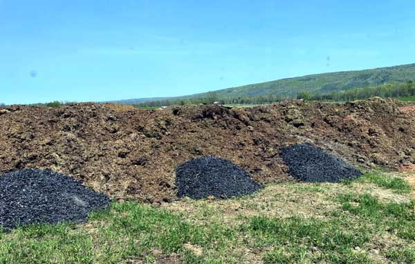 Mixing biochar with compost by Jon Hunt